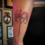Red ink spider lily tattoo